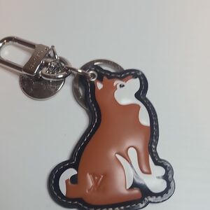 L V Tan and White Dog Charm